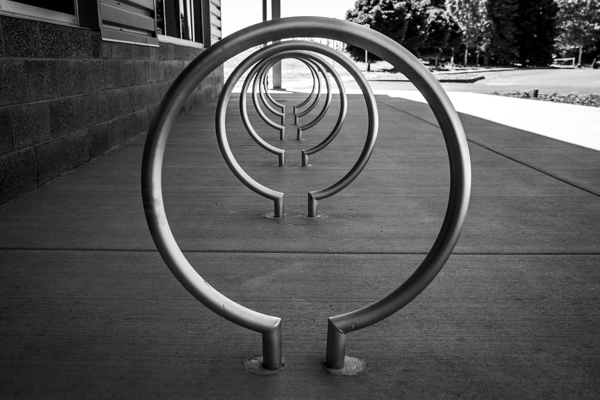Artistic black and white shot of circular bike rack