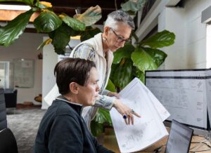 2 women doing thoughtful cad work